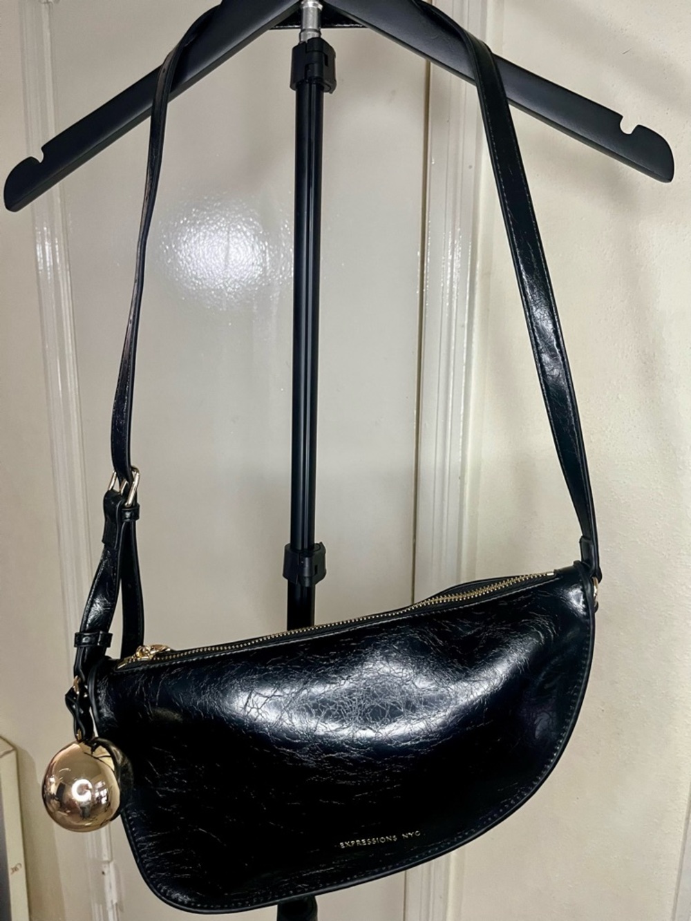 Black Shoulder Bag with Gold Globe Charm